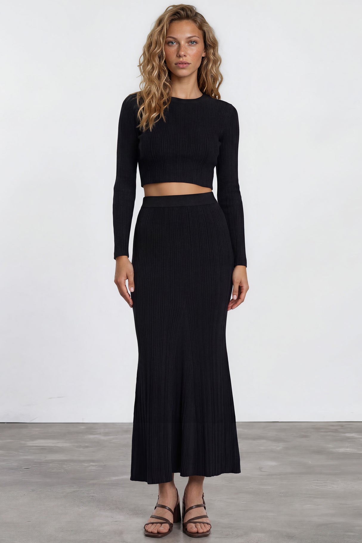 Model wearing Ada Maxi Skirt in Black from Salty Crush