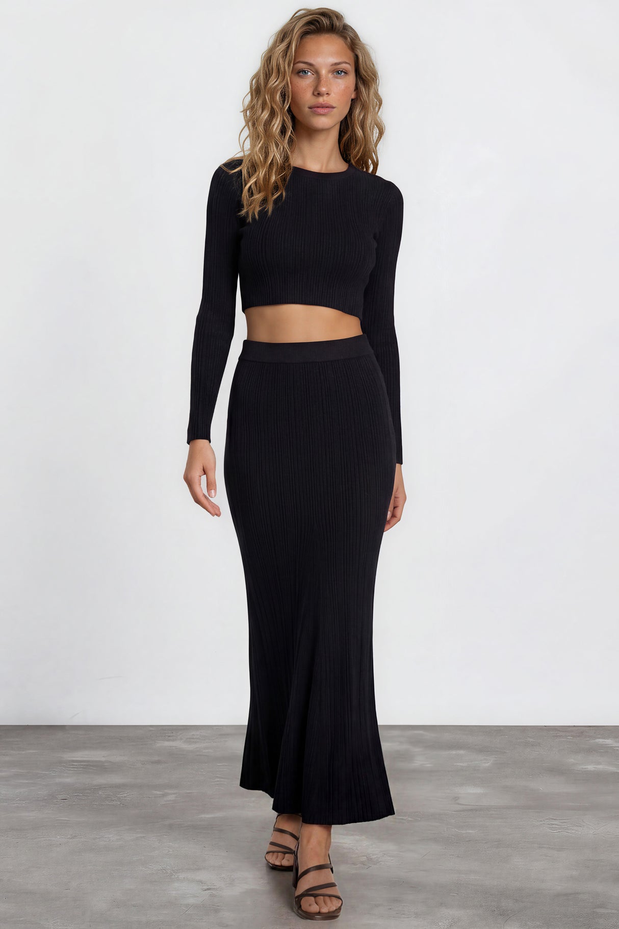 Model wearing Ada Maxi Skirt in Black from Salty Crush