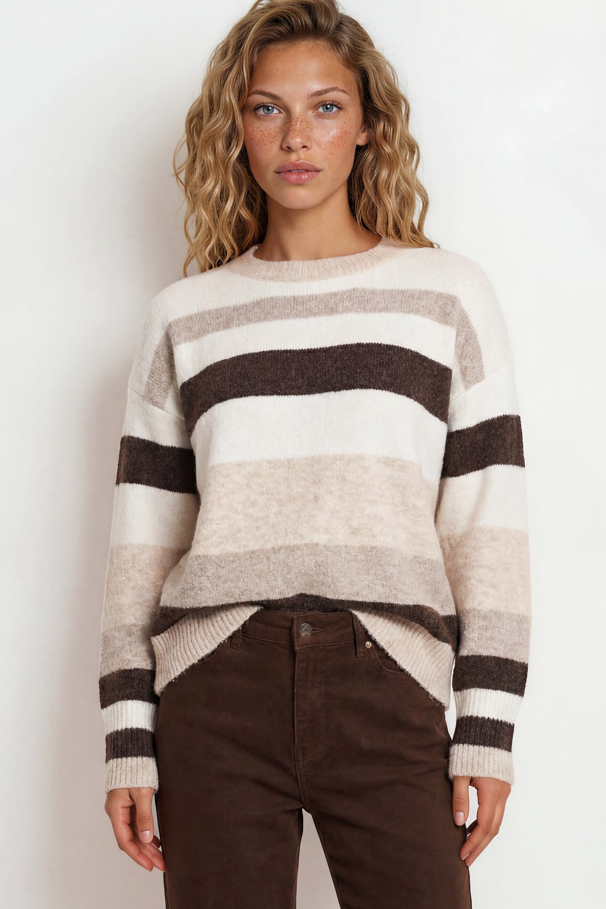 Model wearing Alfie Jumper in Beige from Salty Crush