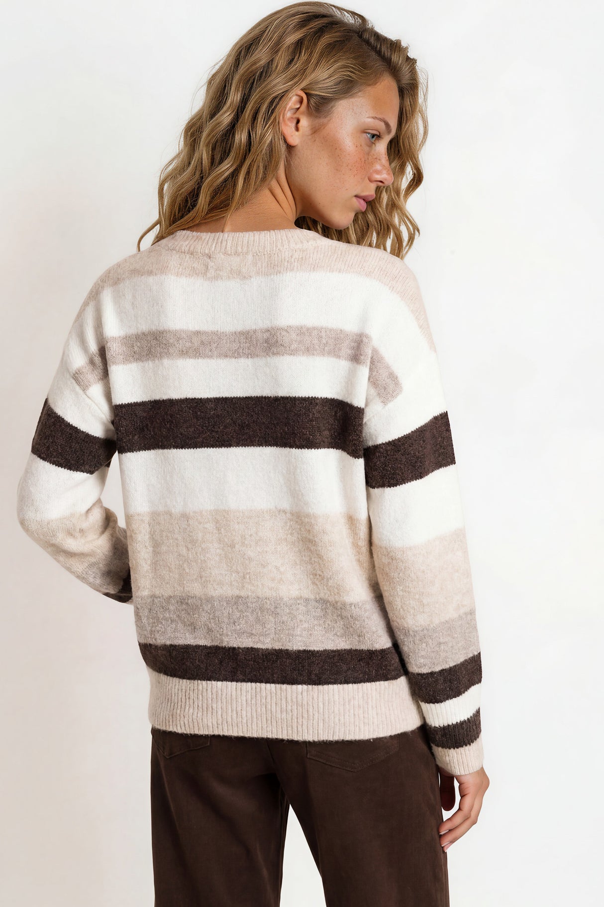 Model wearing Alfie Jumper in Beige from Salty Crush