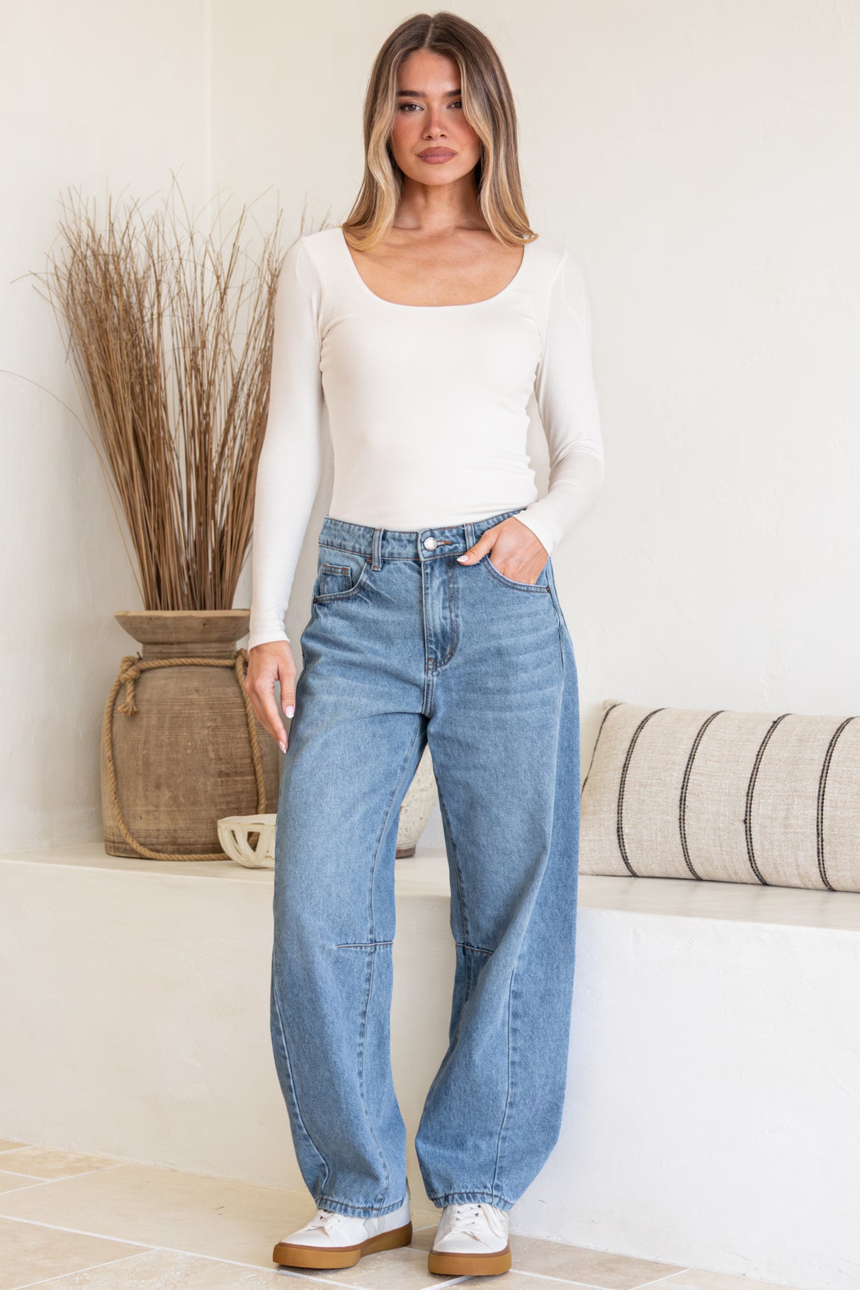 Model wearing Antoni Barrel Jeans in Light Denim Wash from Salty Crush