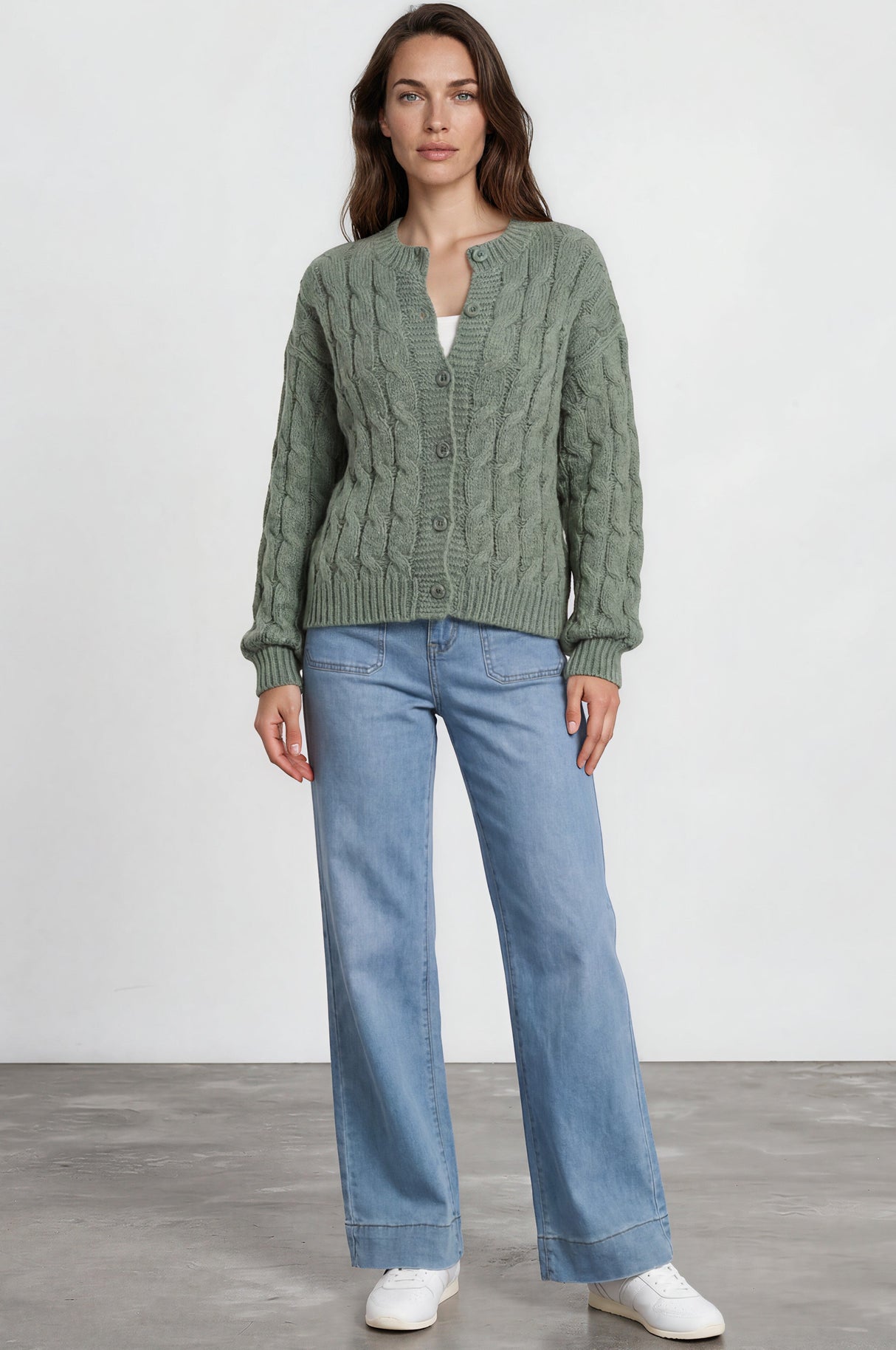 Model wearing Aspen Cardigan in Green from Salty Crush