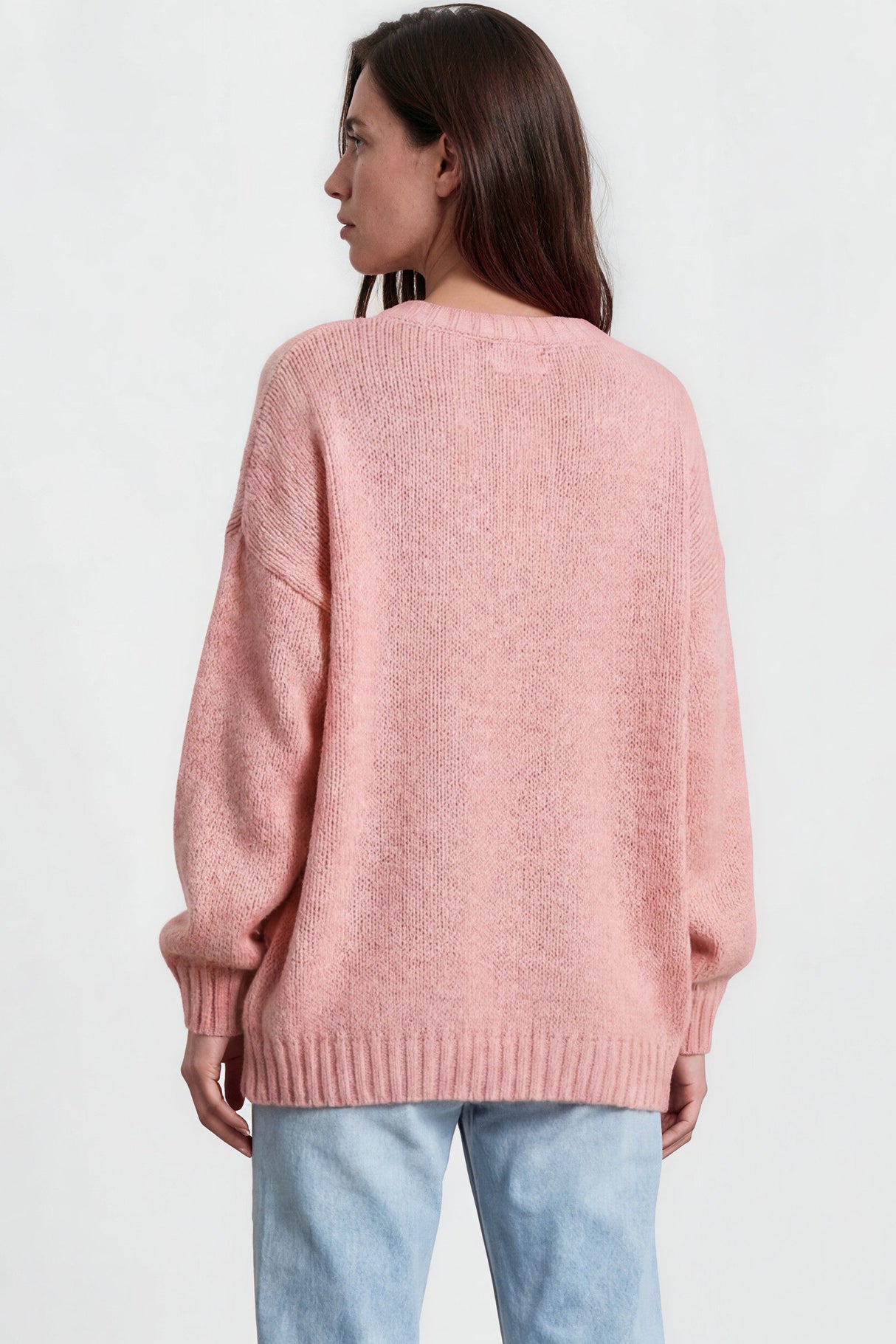 Model wearing Caesar Jumper in Pink from Salty Crush