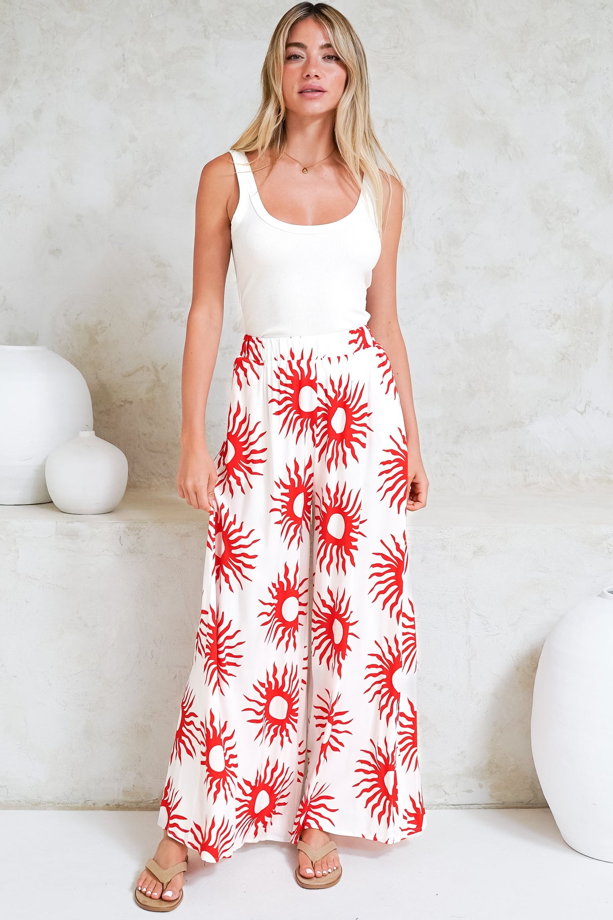 Model wearing Channing Pants in Solar Print Red from Salty Crush