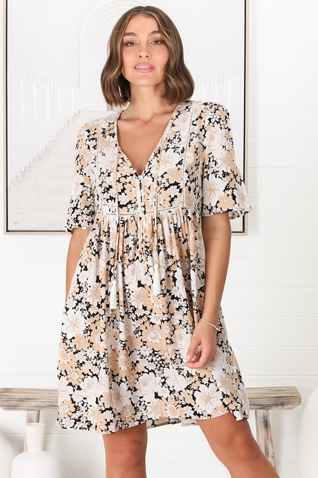 Model wears the Chia Mini Dress - Babydoll Dress in Lyanna Print from Salty Crush