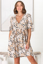 Model wears the Chia Mini Dress - Babydoll Dress in Lyanna Print from Salty Crush