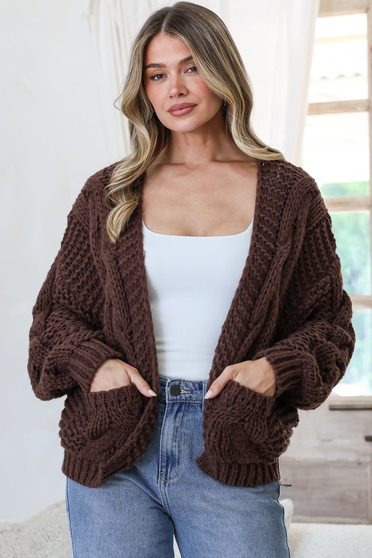 Model wearing Elias Cardigan in Coffee from Salty Crush