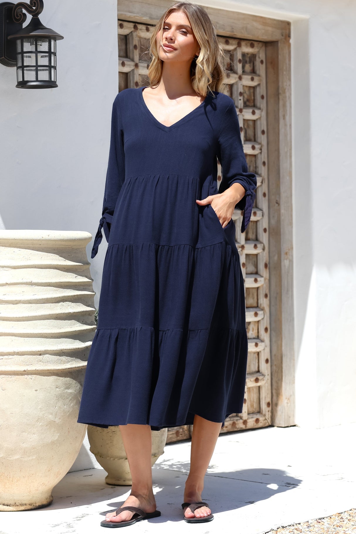 Model wearing Elisabette Midi Dress in Navy from Salty Crush