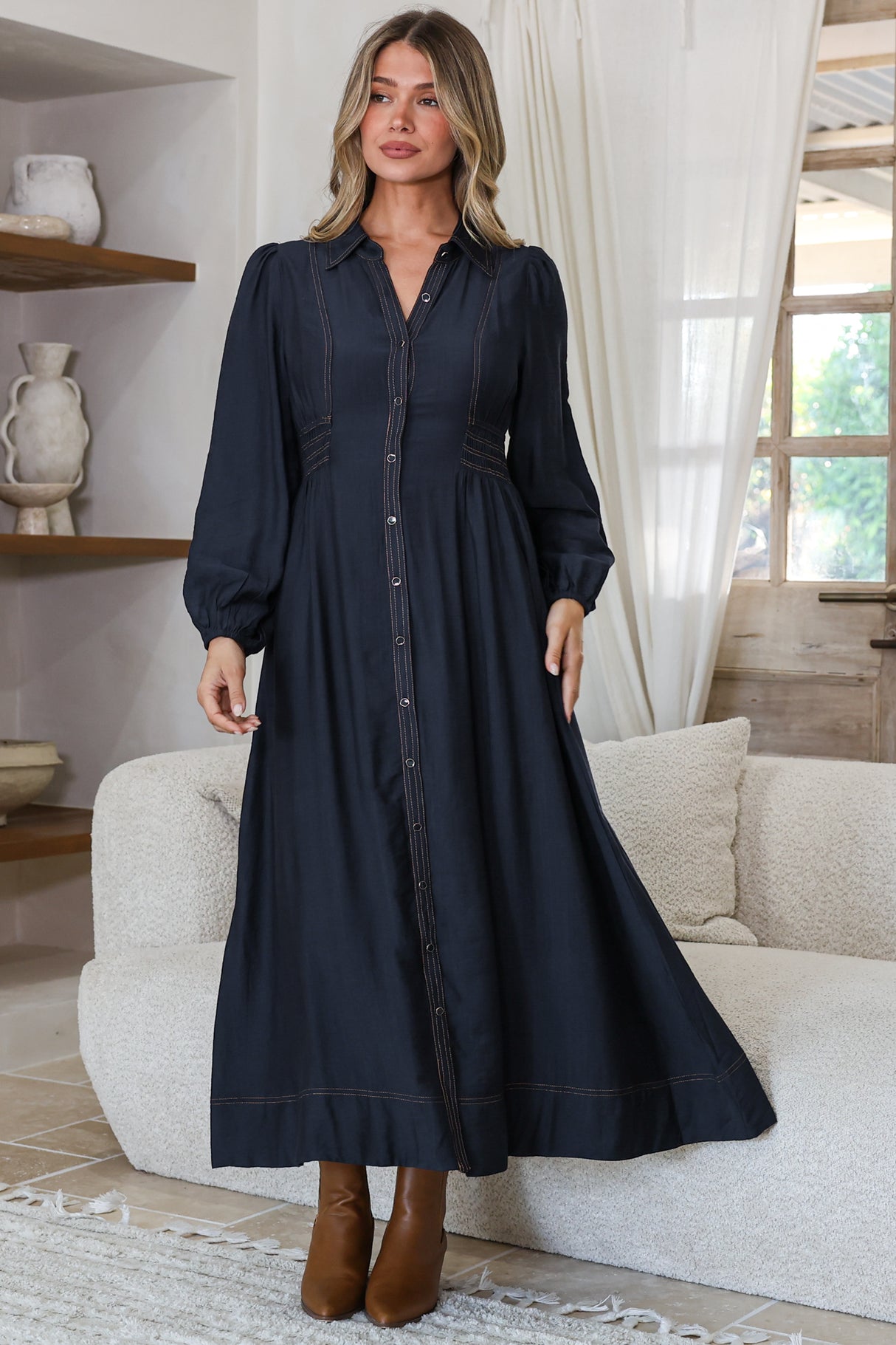 Model wearing Ferris Midi Dress in Navy from Salty Crush