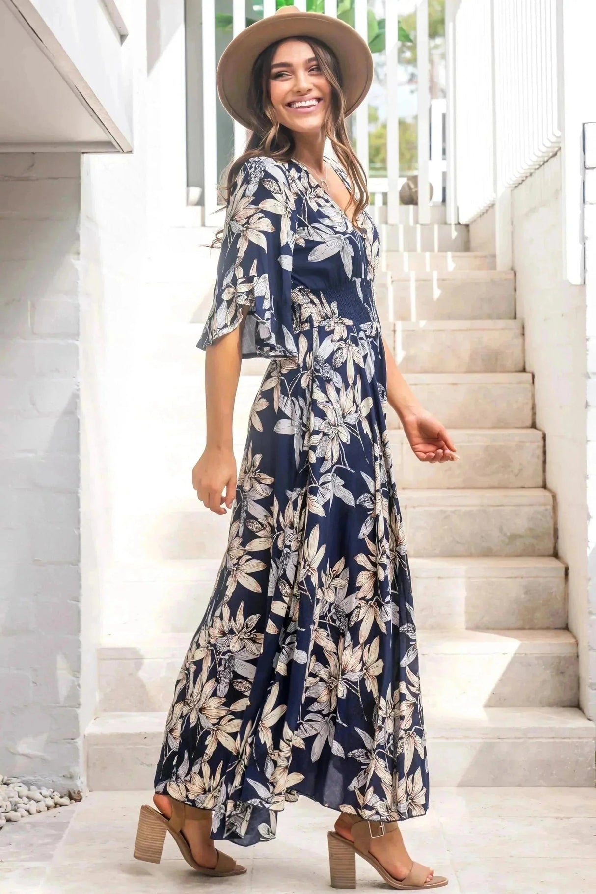 Female wears the floral boho Frigg Maxi Dress from Salty Crush
