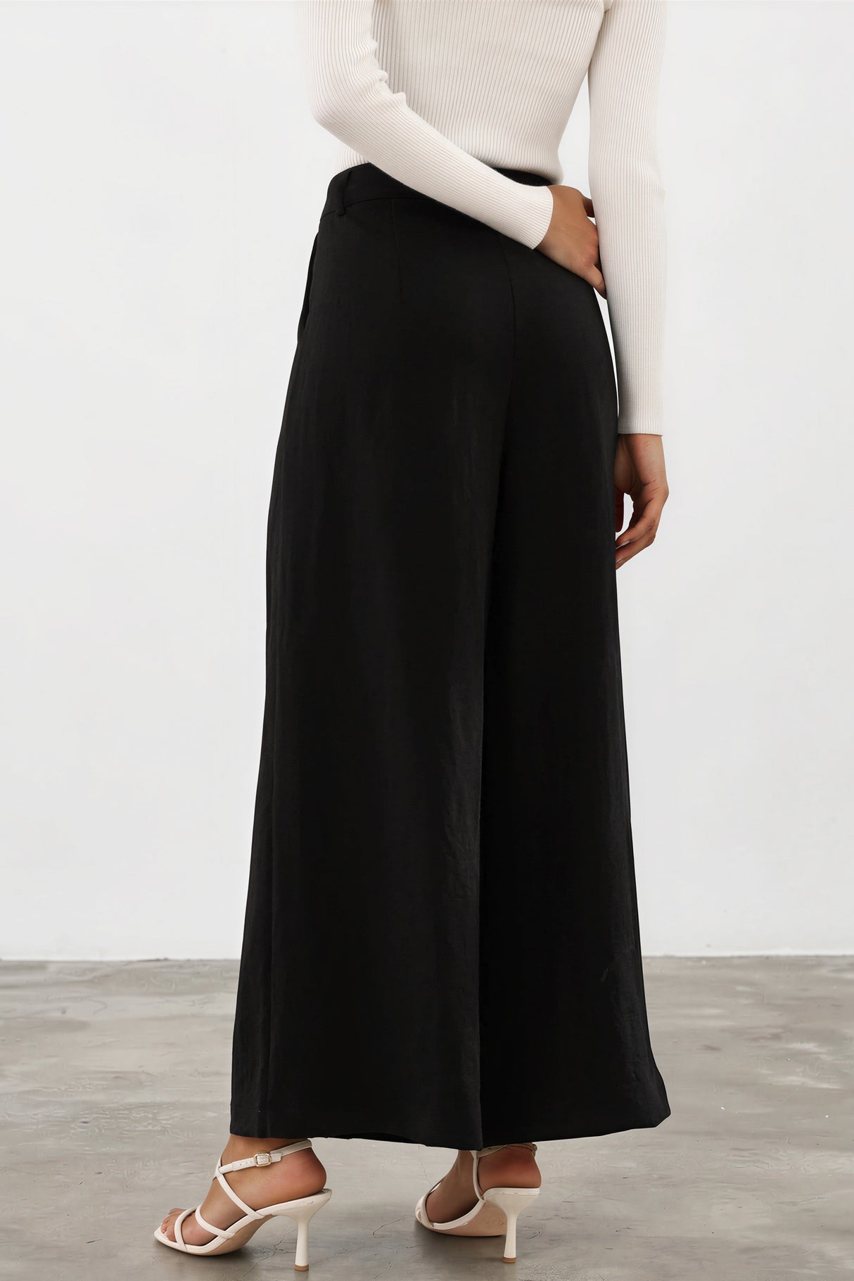 Model wearing Garcia Pants in Black from Salty Crush