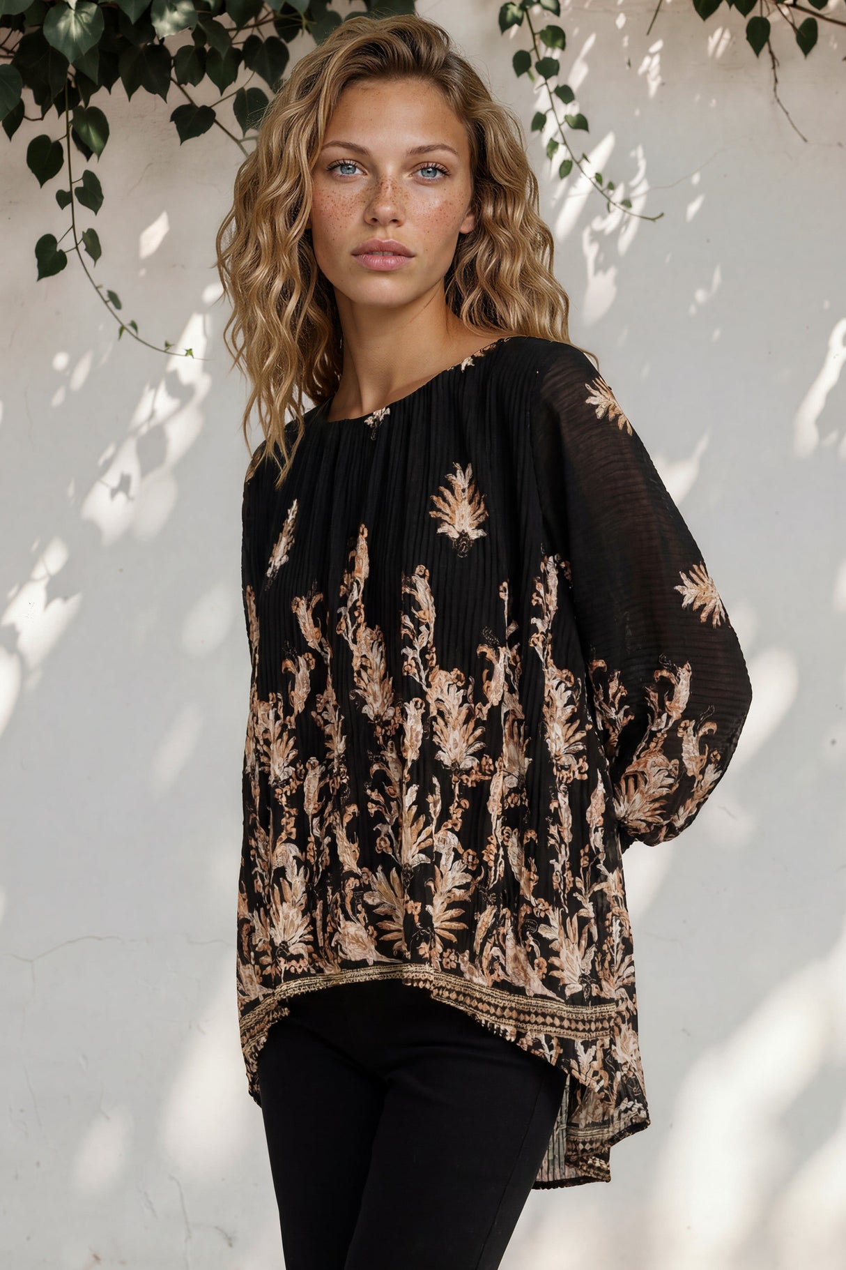 Model wearing Gelina Top in Lynsey Print Black from Salty Crush