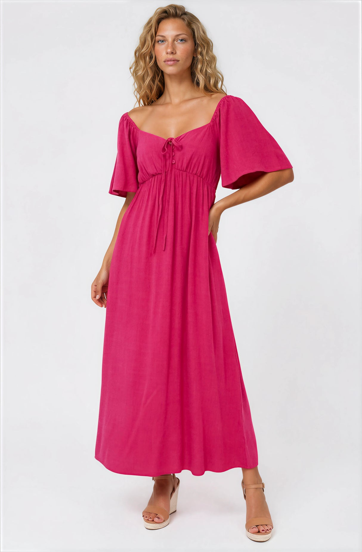 Model wearing Henrietta Midi Dress in Hot Pink from Salty Crush