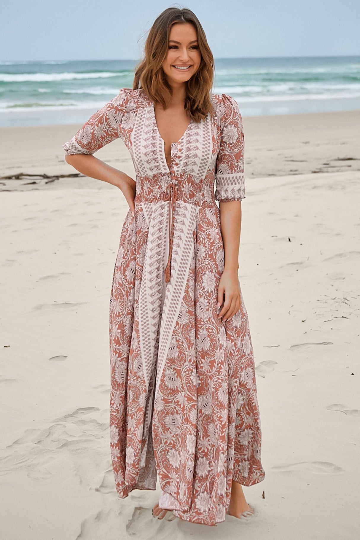 JAASE - Indiana Maxi Dress: Lace Back Shirred Waist A Line Dress with Handkerchief Hemline in Indah Print