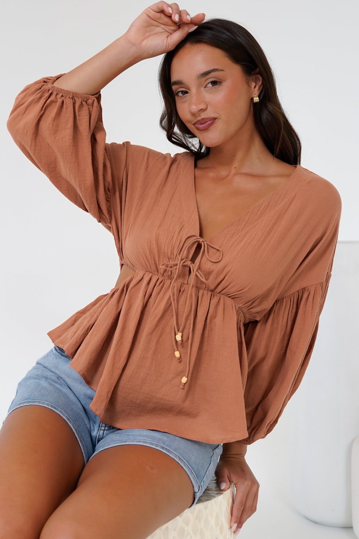Jacobson Top - Peplum Top with Side Cut Outs and Voluminous Sleeves in Tan