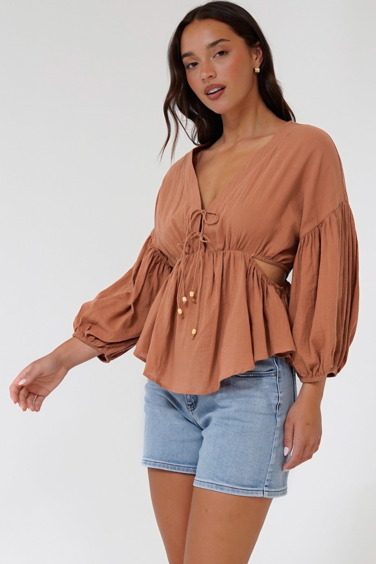 Jacobson Top - Peplum Top with Side Cut Outs and Voluminous Sleeves in Tan