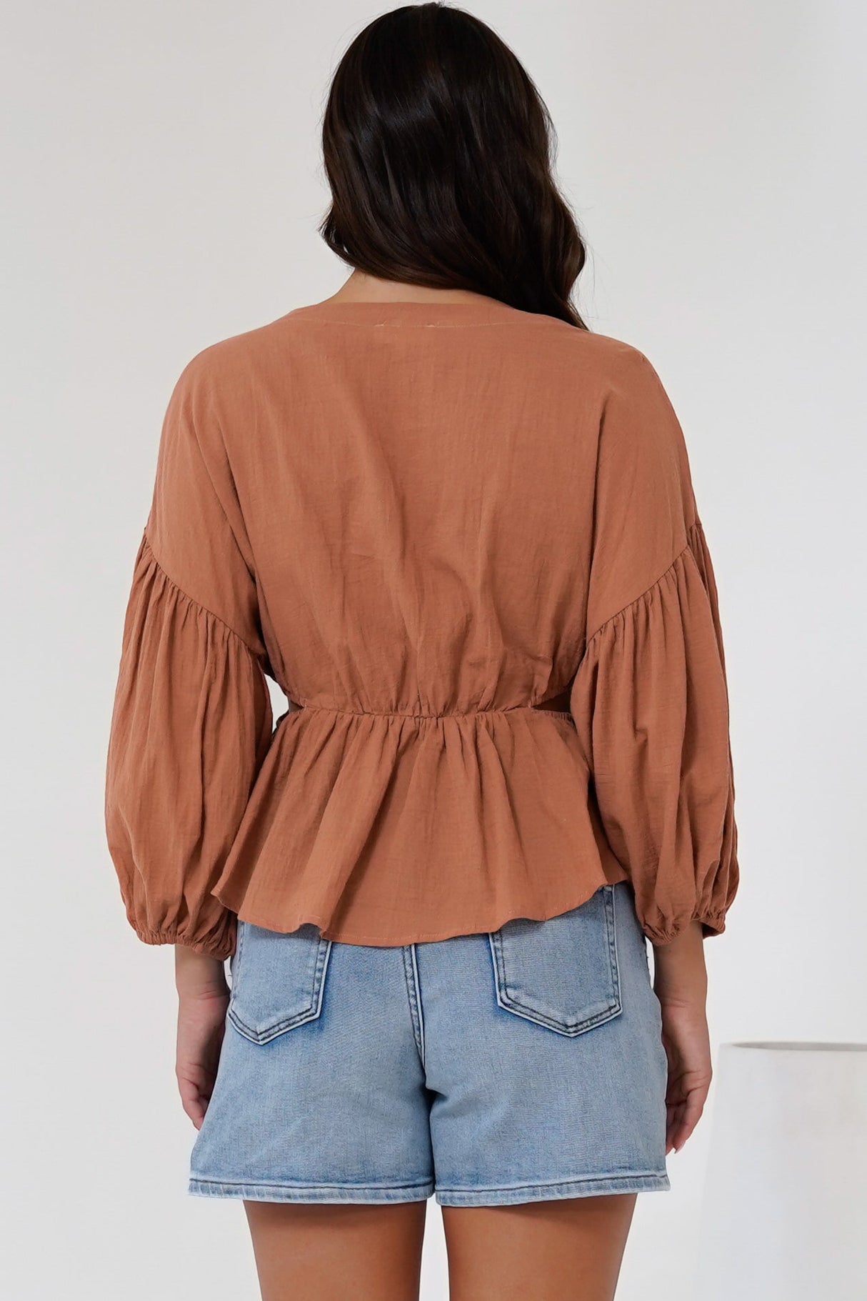 Jacobson Top - Peplum Top with Side Cut Outs and Voluminous Sleeves in Tan