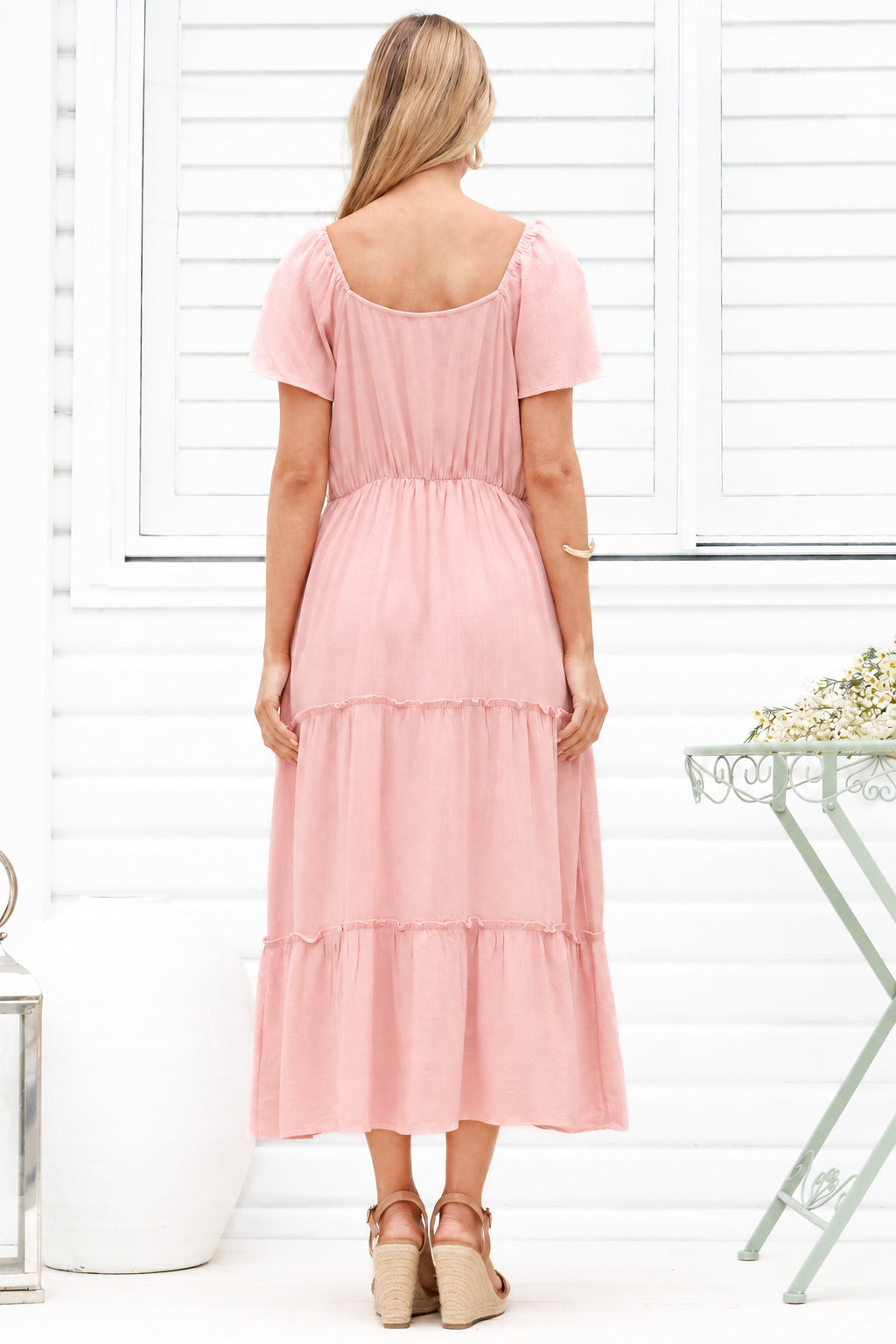 Model wearing Karina Midi Dress in Pink from Salty Crush