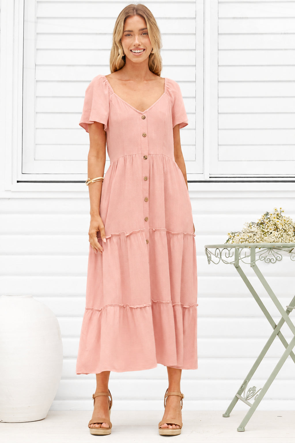 Model wearing Karina Midi Dress in Pink from Salty Crush