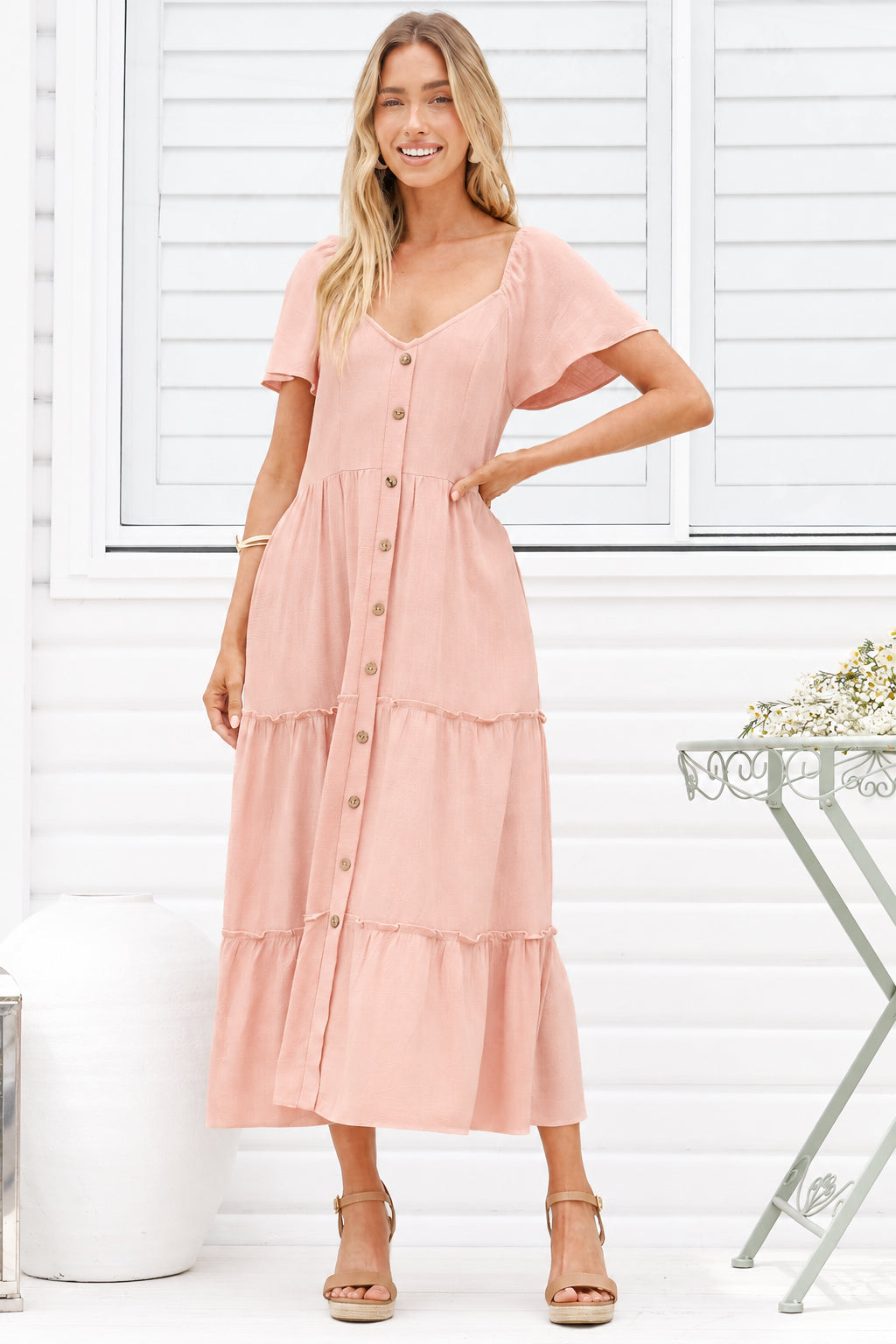 Model wearing Karina Midi Dress in Pink from Salty Crush