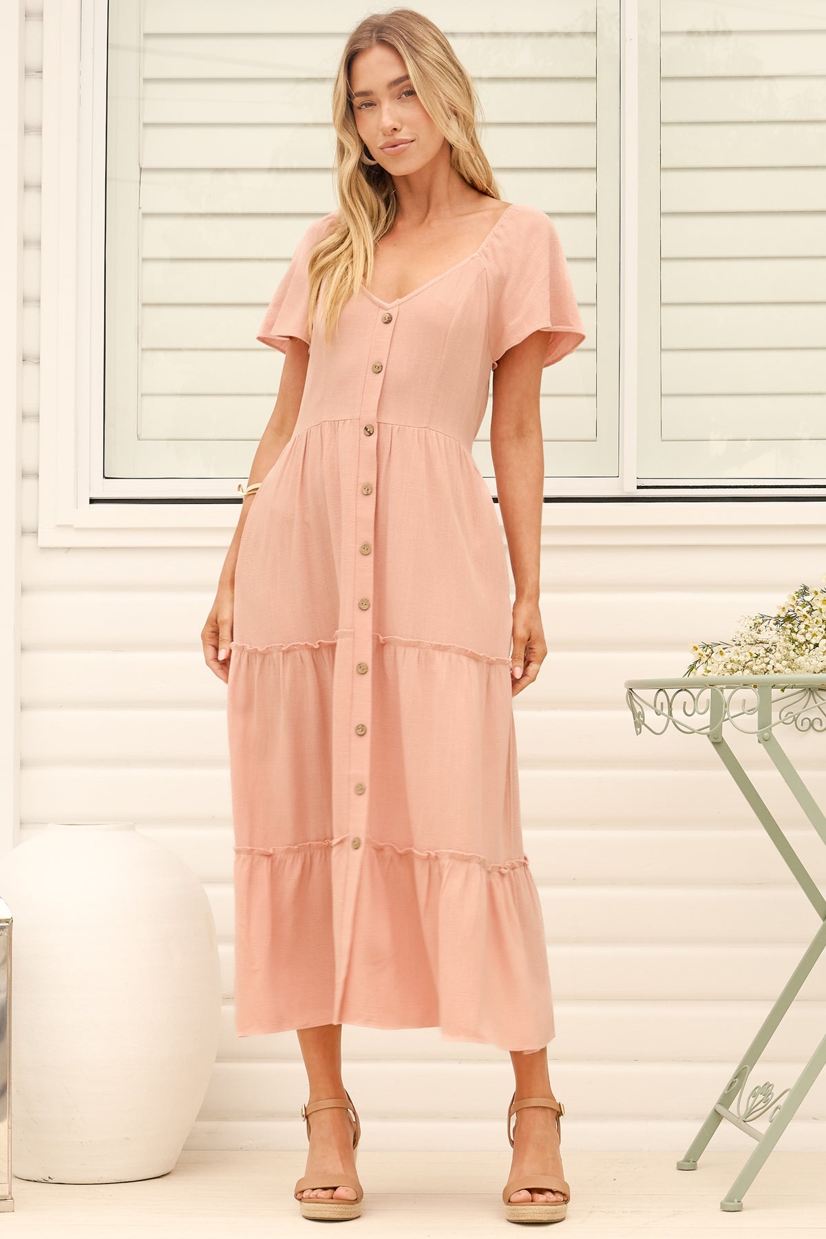 Model wearing Karina Midi Dress in Pink from Salty Crush