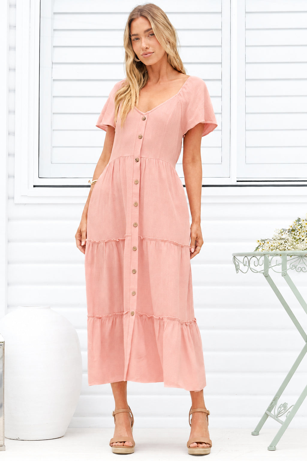 Model wearing Karina Midi Dress in Pink from Salty Crush
