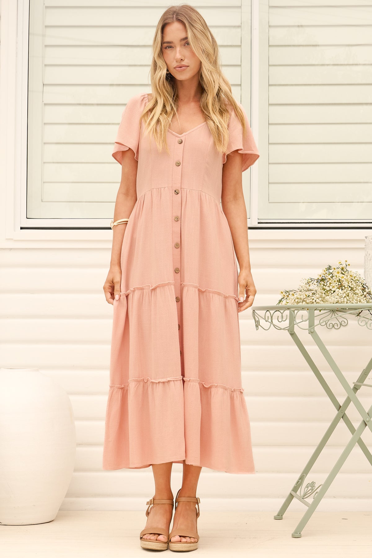 Model wearing Karina Midi Dress in Pink from Salty Crush