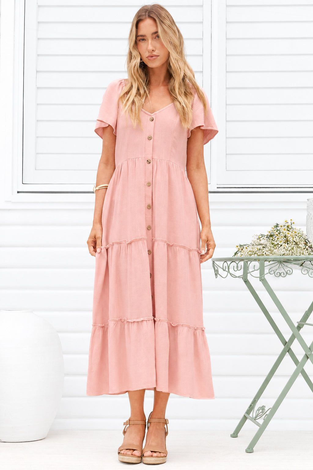 Model wearing Karina Midi Dress in Pink from Salty Crush