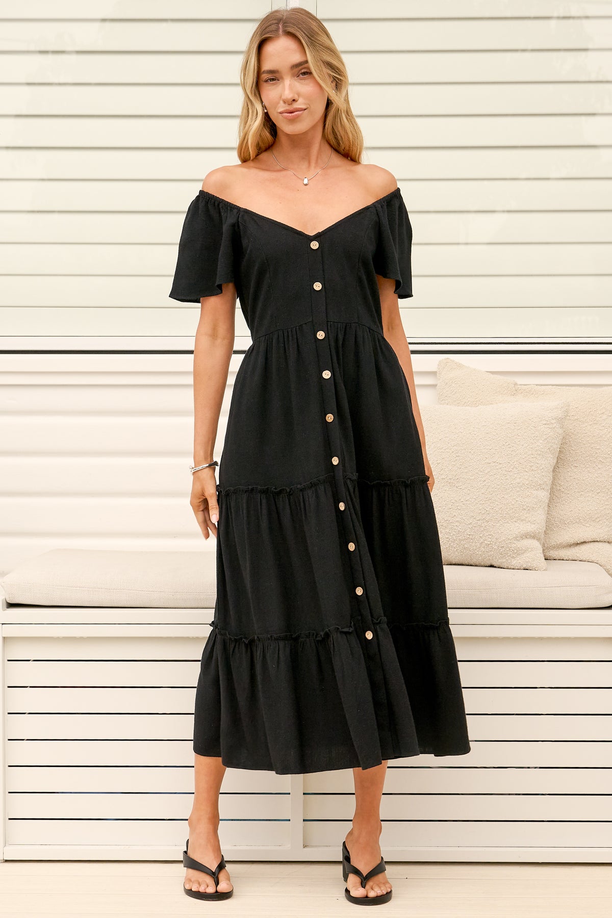 Model wearing Karina Midi Dress in Black from Salty Crush