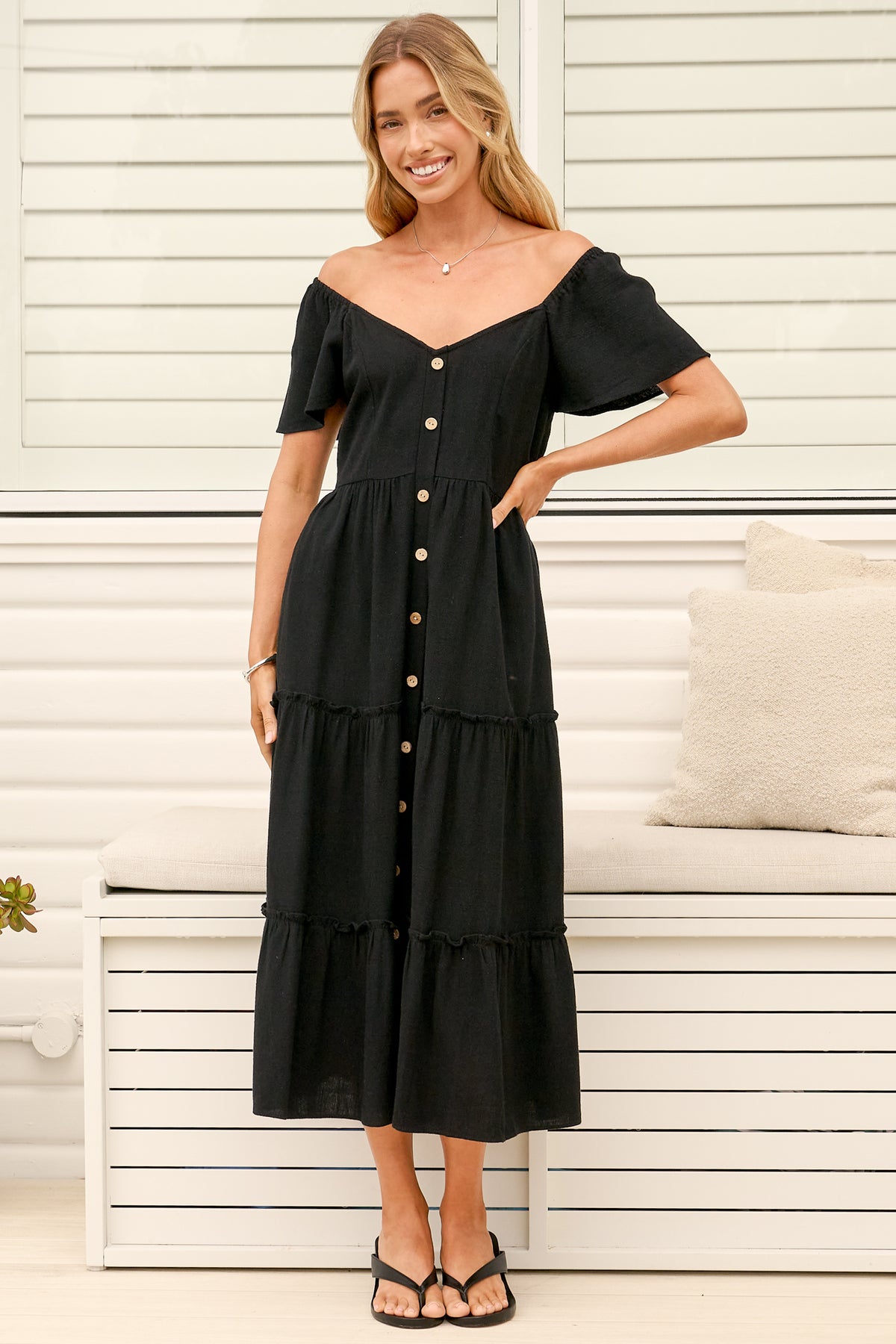 Model wearing Karina Midi Dress in Black from Salty Crush