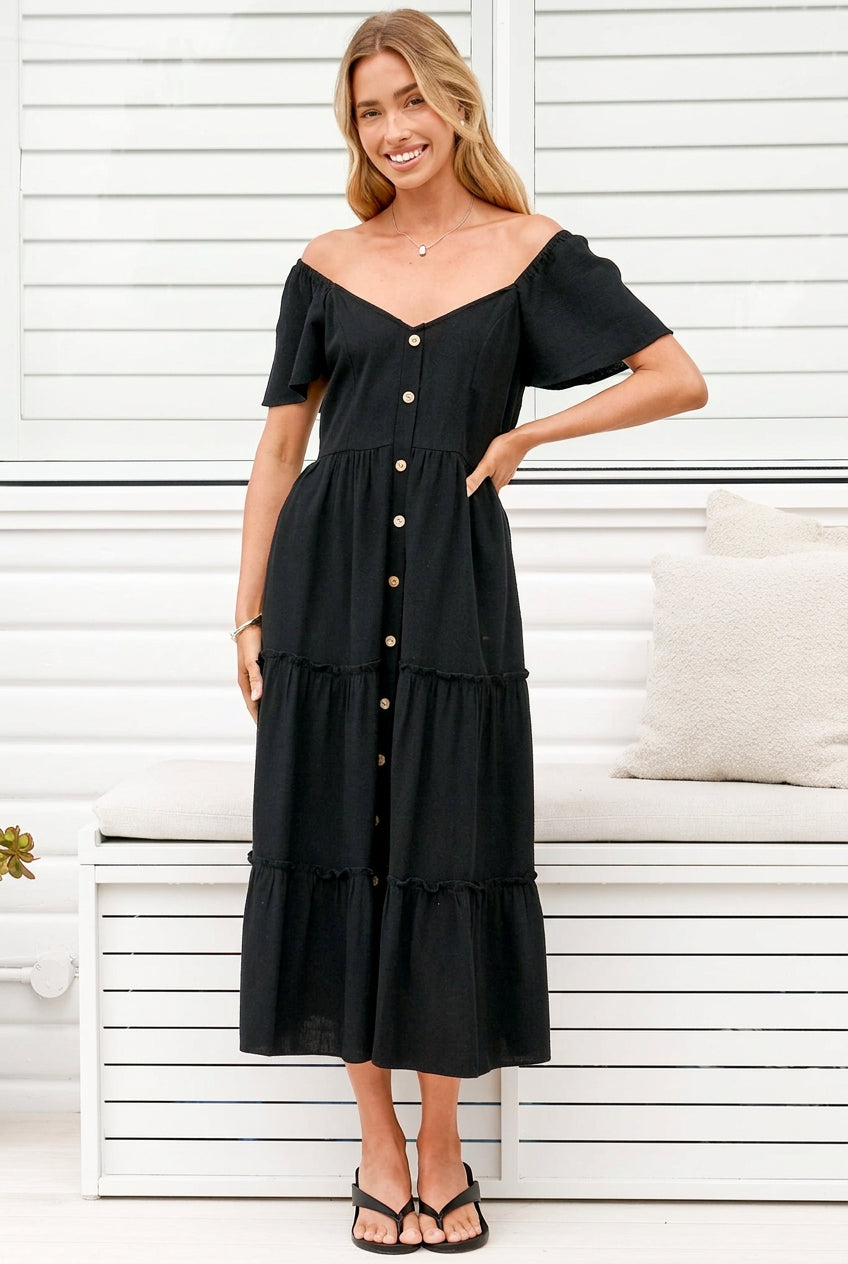 Model wearing Karina Midi Dress in Black from Salty Crush