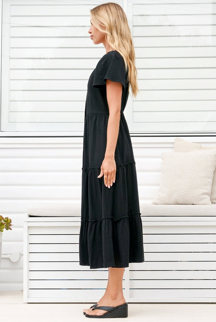 Model wearing Karina Midi Dress in Black from Salty Crush