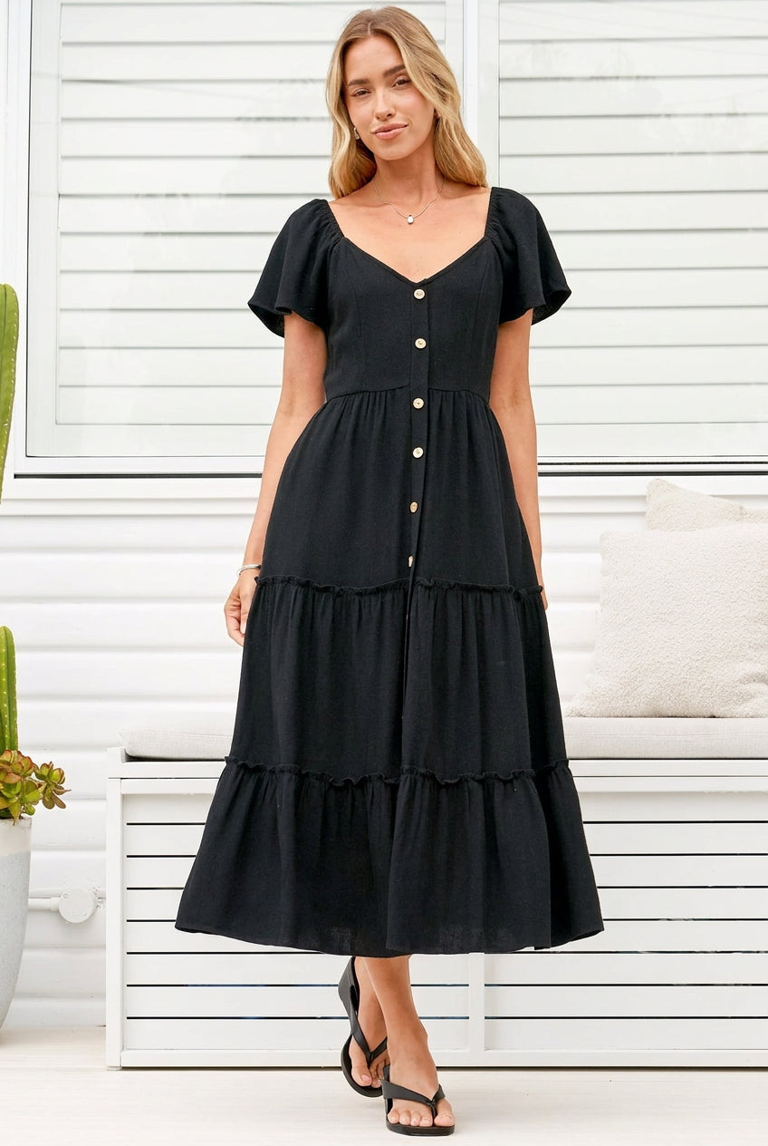 Model wearing Karina Midi Dress in Black from Salty Crush