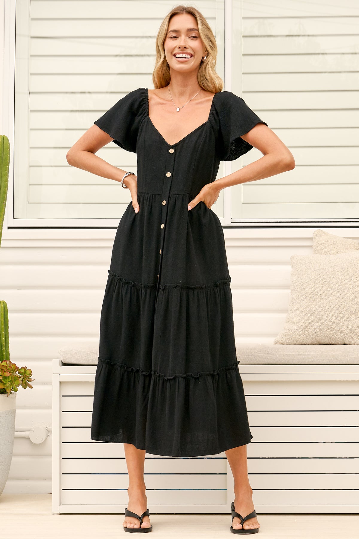 Model wearing Karina Midi Dress in Black from Salty Crush
