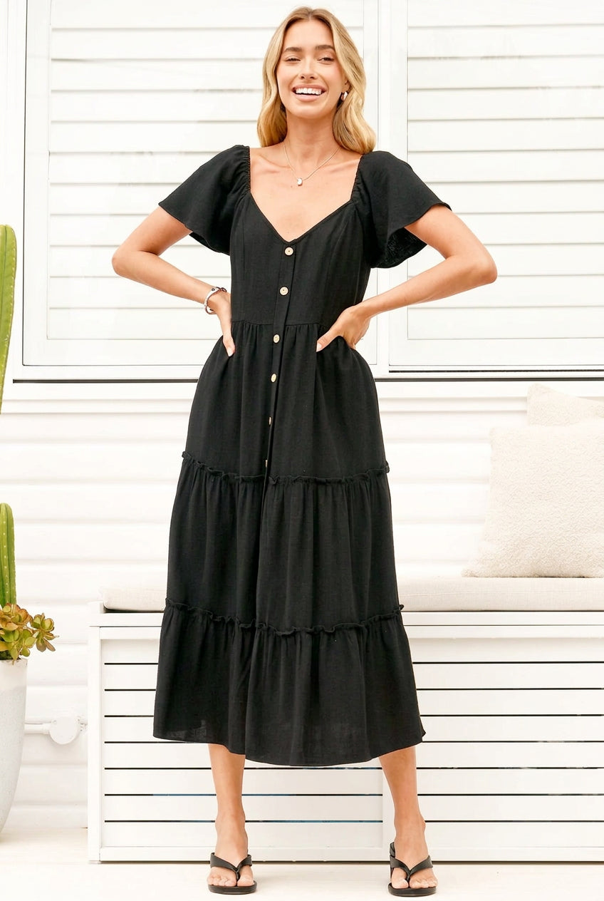 Model wearing Karina Midi Dress in Black from Salty Crush