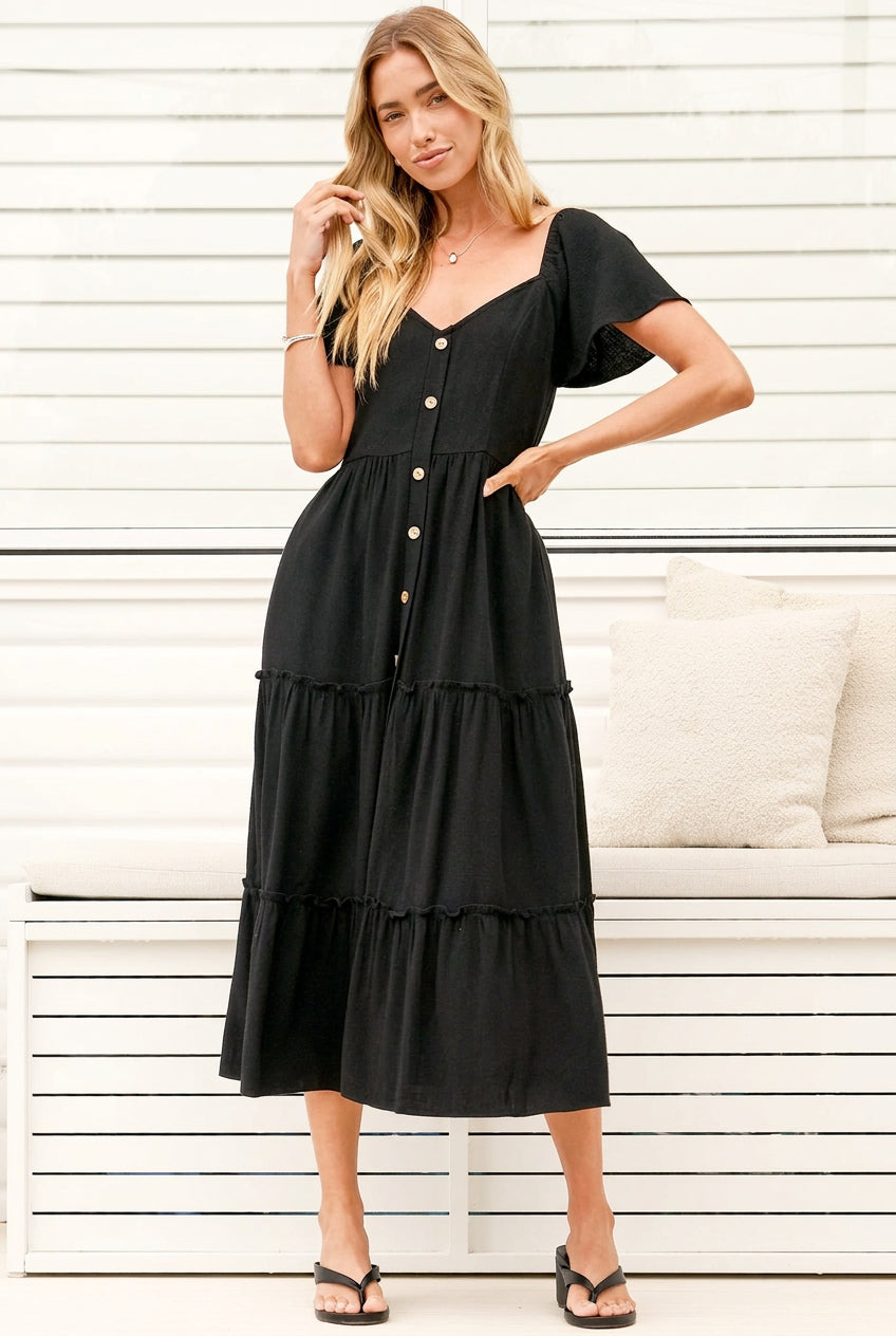 Model wearing Karina Midi Dress in Black from Salty Crush