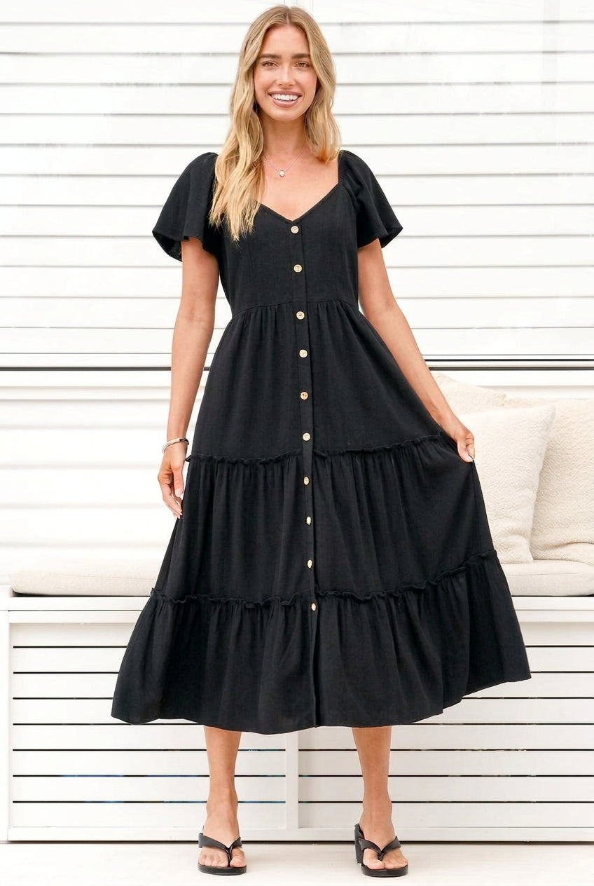 Model wearing Karina Midi Dress in Black from Salty Crush