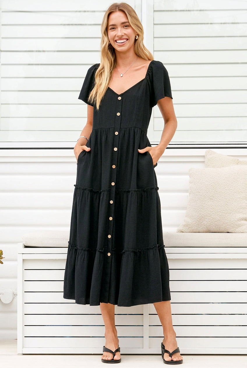 Model wearing Karina Midi Dress in Black from Salty Crush