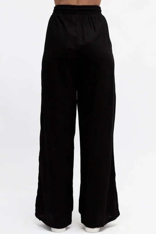 Black wide-leg pants on a white background
