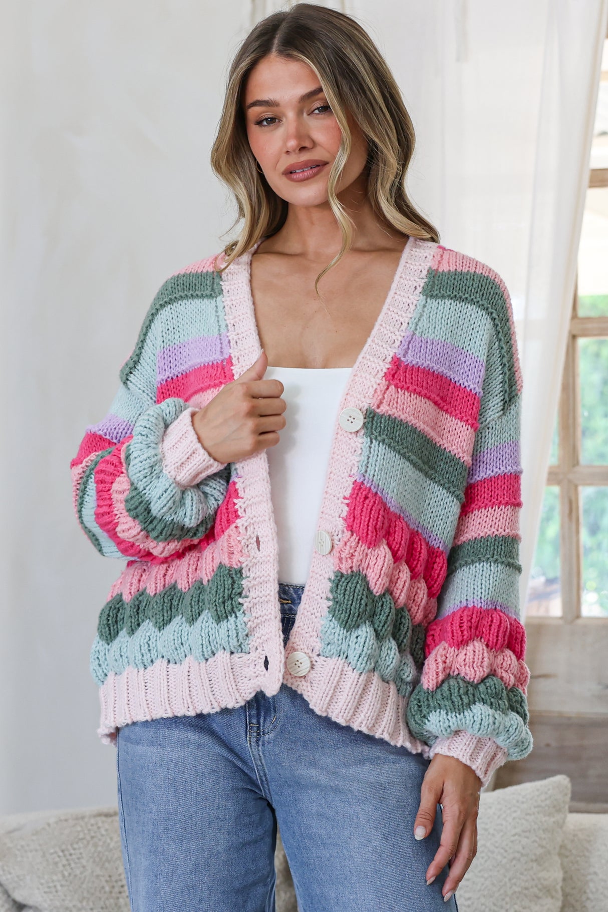 Model wearing Lainey Cardigan in Watermelon from Salty Crush