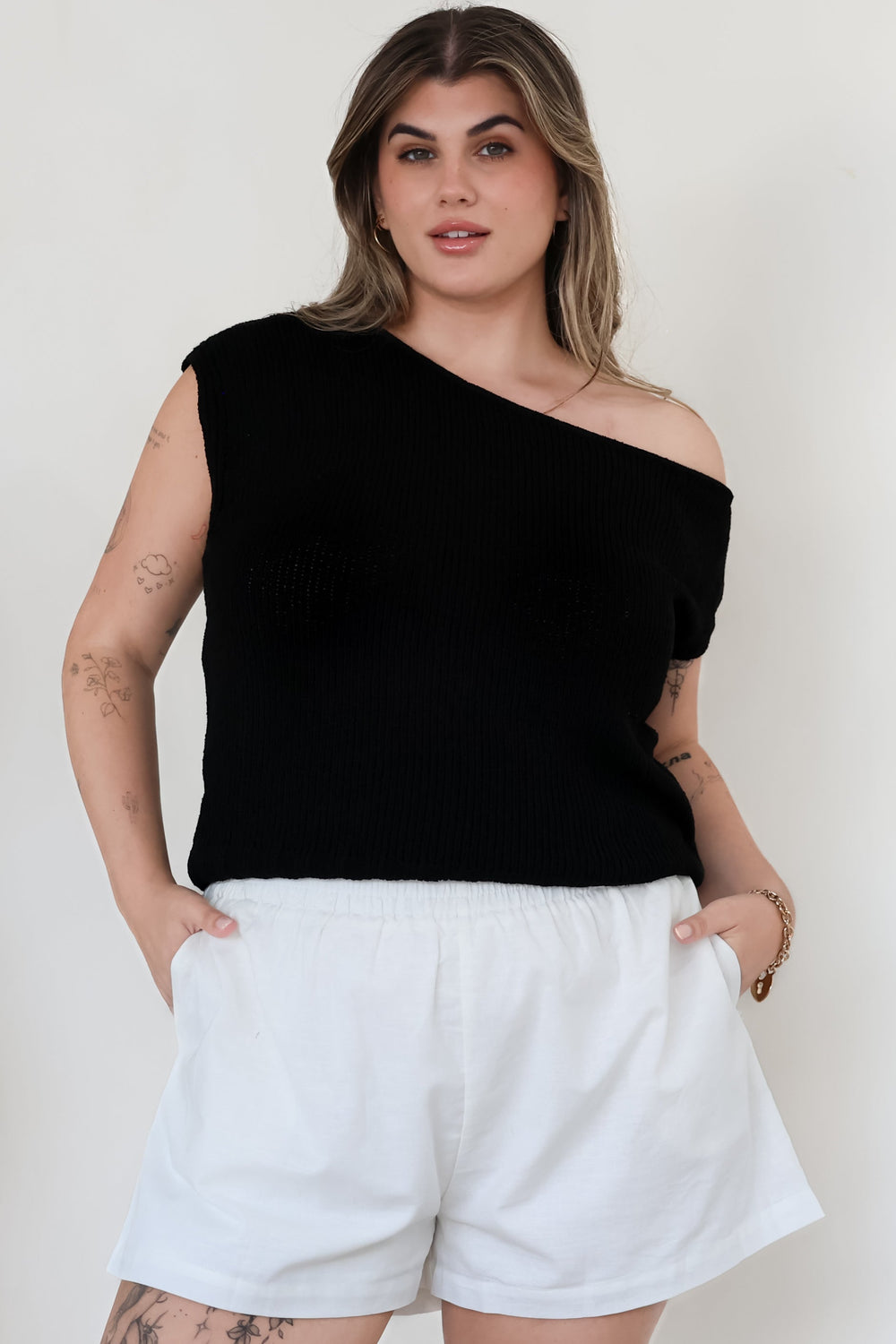 Mariah Knit Top - Sleeveless Asymmetric Neckline Top with Ribbed Hem in Black