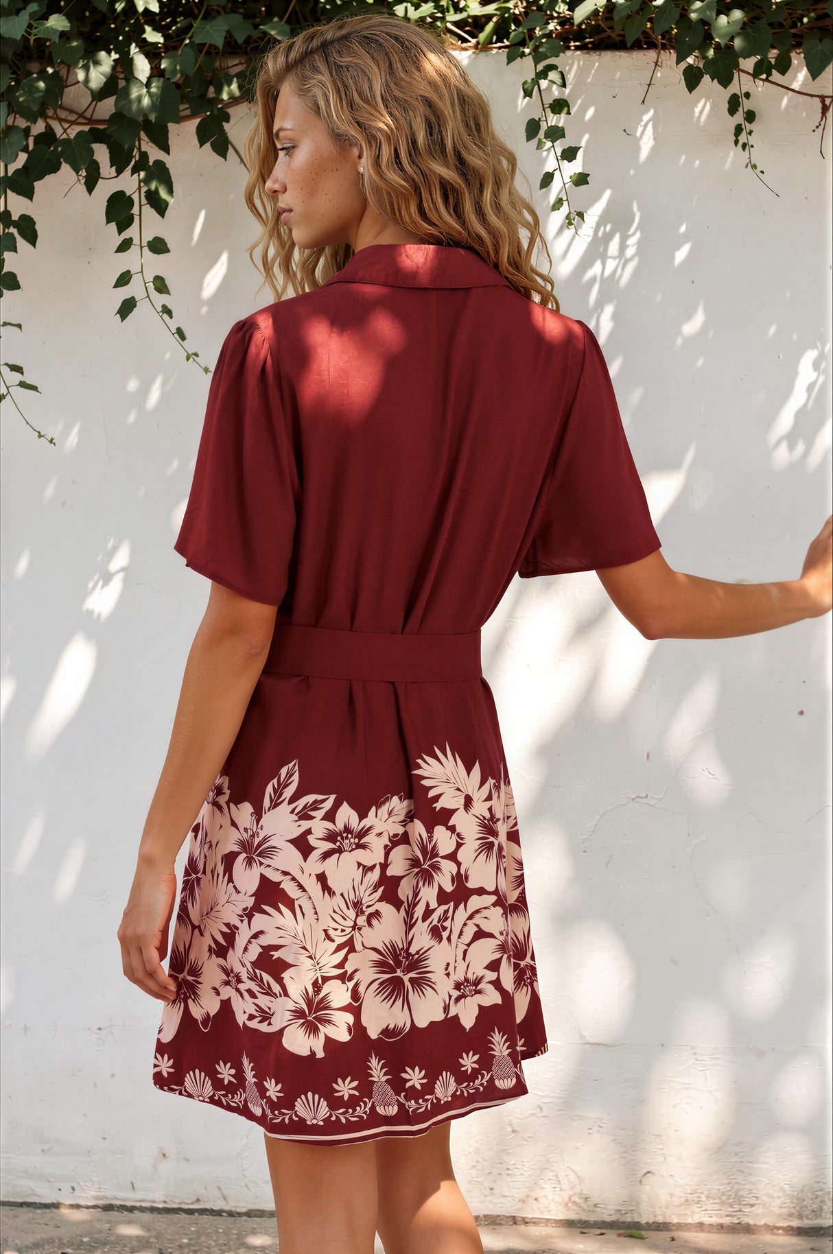 Model wearing Mikan Mini Dress in Orabella Print Wine from Salty Crush
