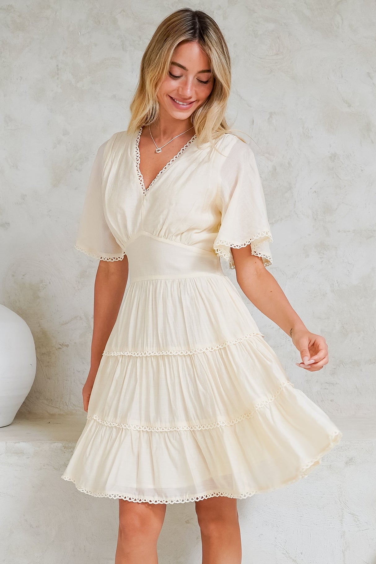 Nessie Mini Dress - Lace Trim Tiered Dress with Flutter Sleeves in Cream
