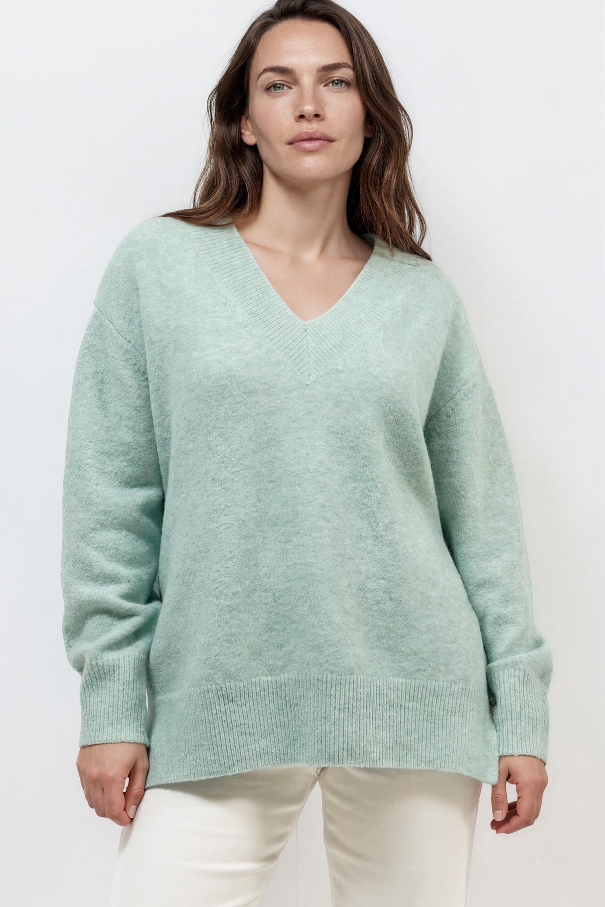 Model wearing Nikita Jumper in Green from Salty Crush
