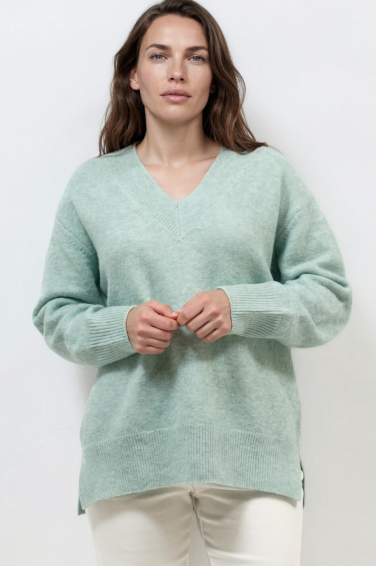 Model wearing Nikita Jumper in Green from Salty Crush
