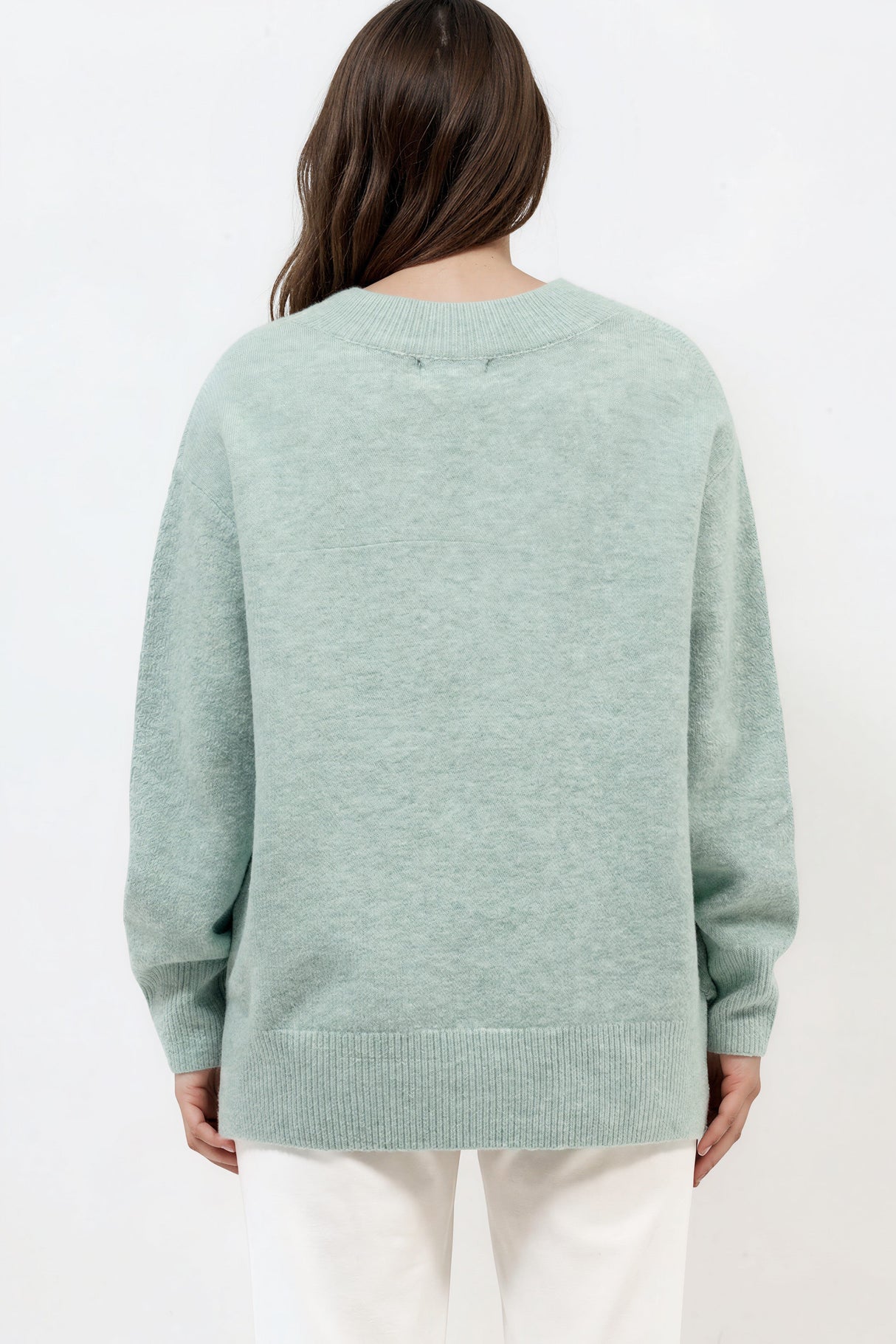 Model wearing Nikita Jumper in Green from Salty Crush