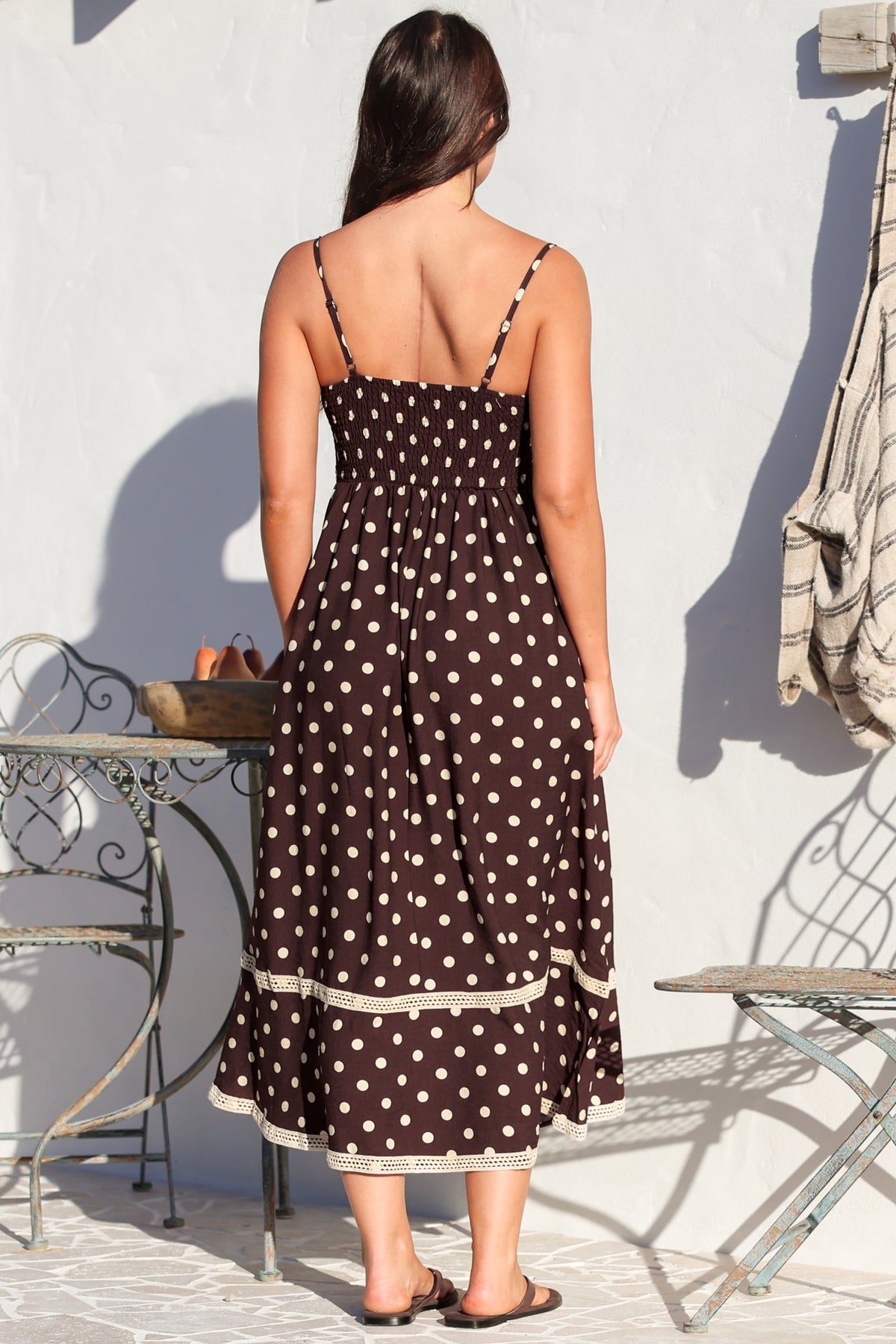 Model wearing Novalie Midi Dress in Polka Chocolate from Salty Crush