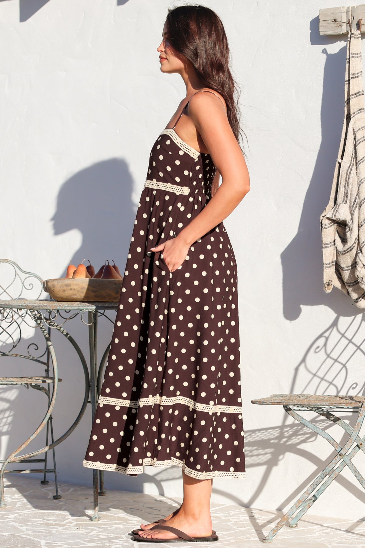 Model wearing Novalie Midi Dress in Polka Chocolate from Salty Crush