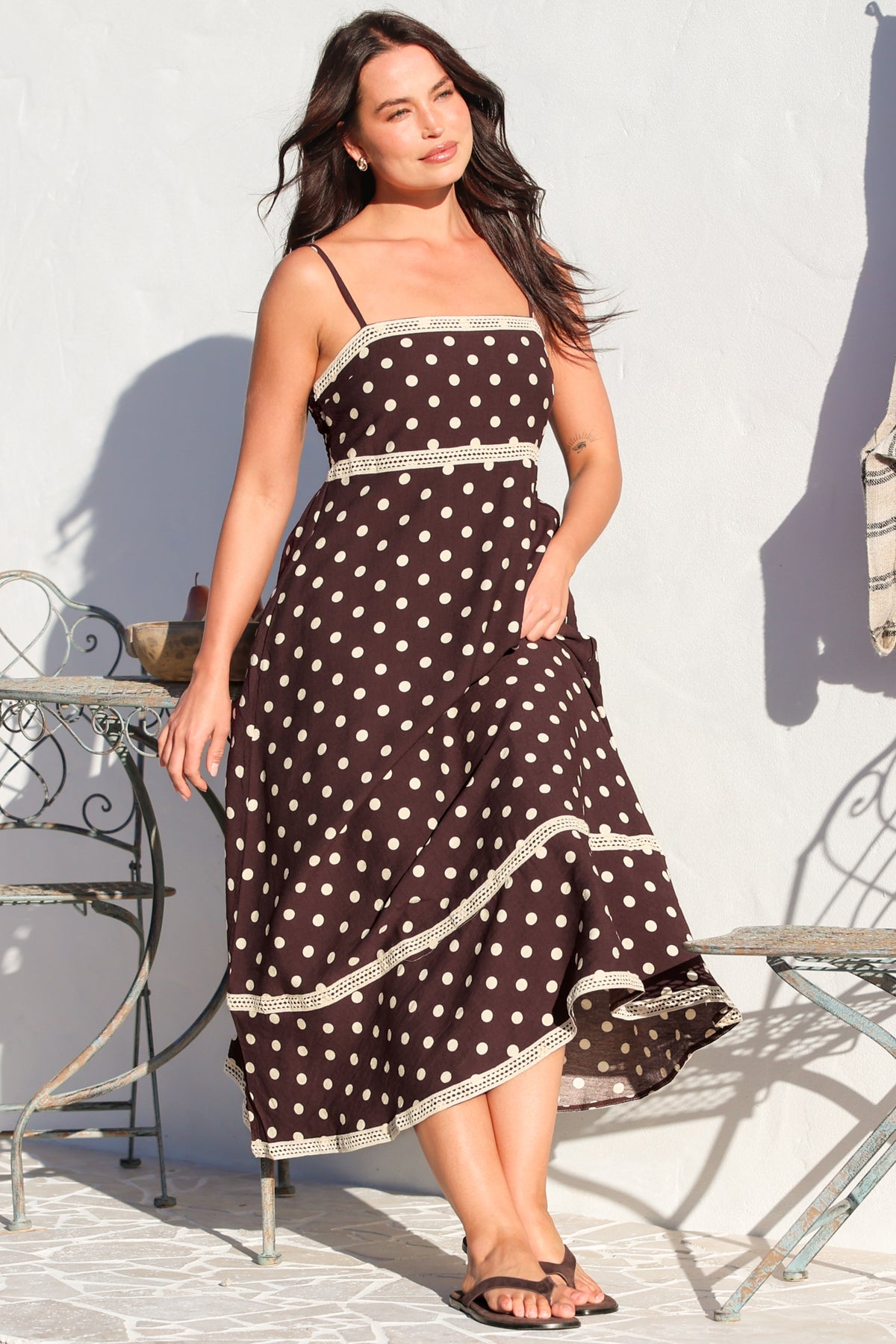 Model wearing Novalie Midi Dress in Polka Chocolate from Salty Crush