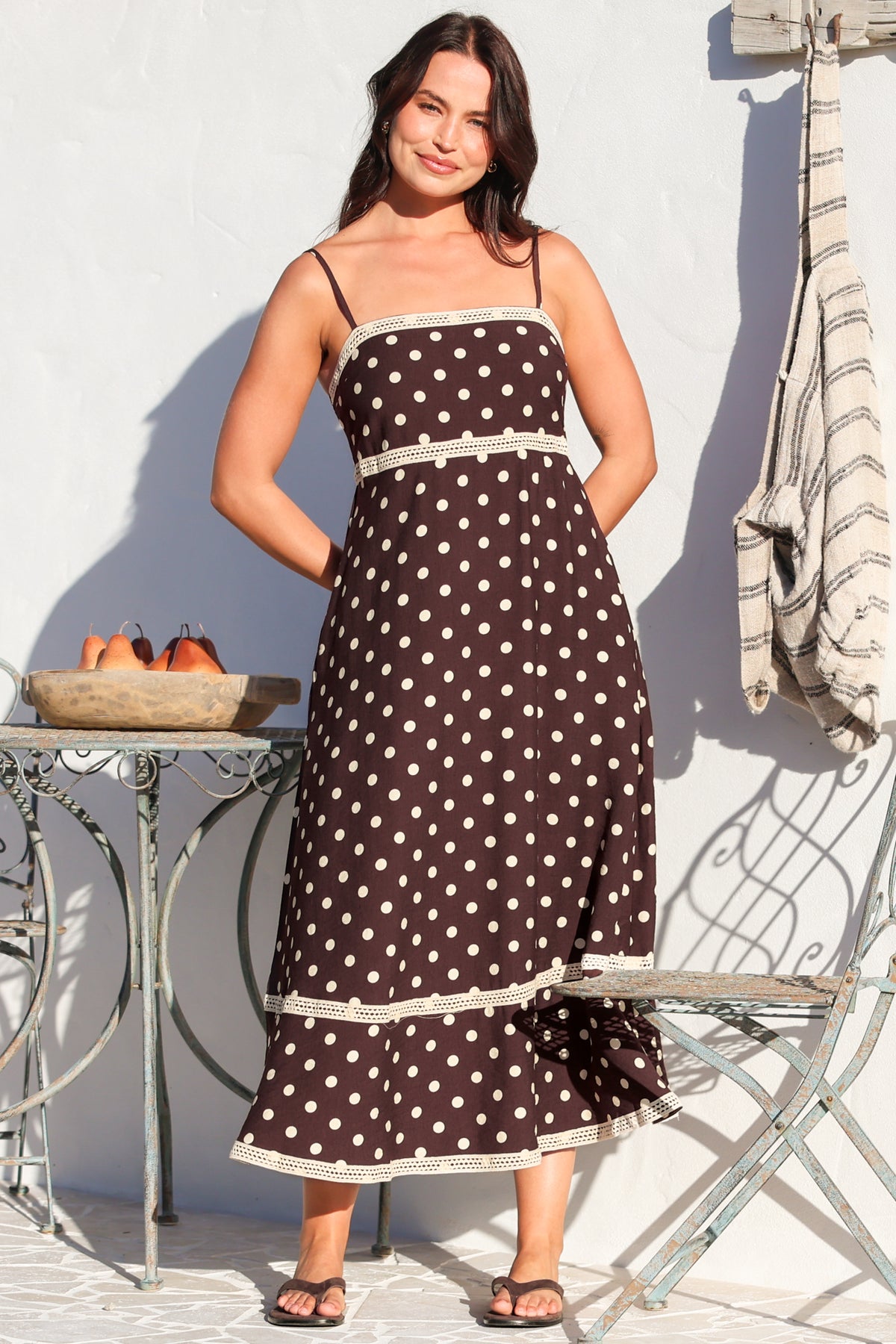 Model wearing Novalie Midi Dress in Polka Chocolate from Salty Crush
